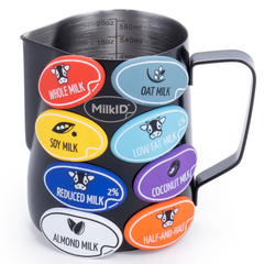 Compact 20oz (600ml) black pitcher with attached color-coded labels for quick milk identification in coffee shops and home kitchens.